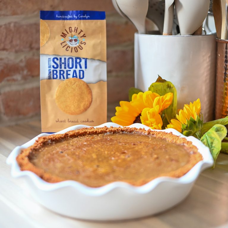 Mightylicious Gluten-Free Pumpkin Pie with a Brown Butter Shortbread Cookie Crust in a white ceramic pie dish.